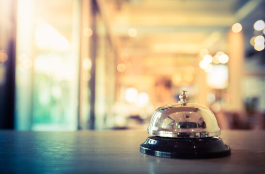 bell at hotel front desk | Hospitality Management Challenges | SLM Facility Solutions Nationwide